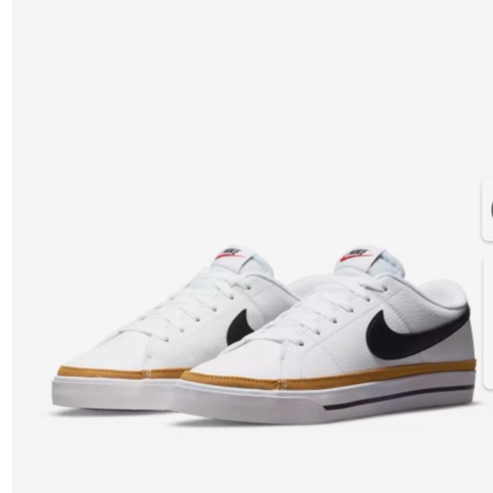 Nike Women’s White Low-Top Sneakers with Black Swoosh and Gold Trim